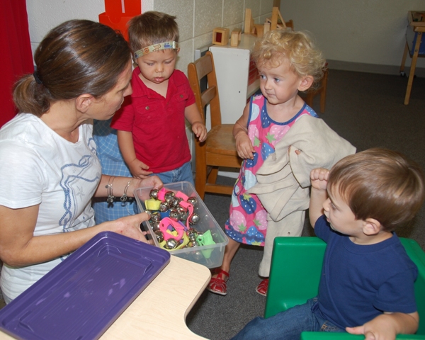 Girls and boys with ''Miss Danielle'' at St. Mark's Toddler Playgroup